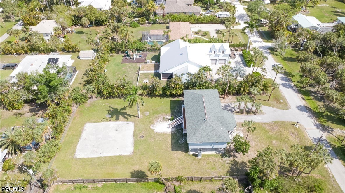 16380 Arbor Ridge Drive Fort Myers, FL 33908 - Photo 46 of 47 a view of a lake with a building in the background