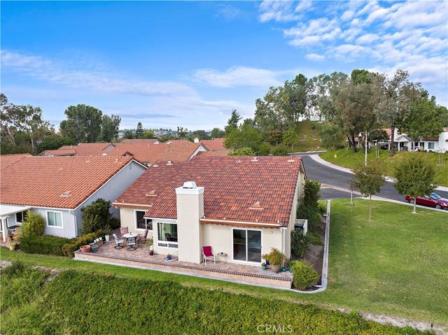 a view of house with outdoor space and garden