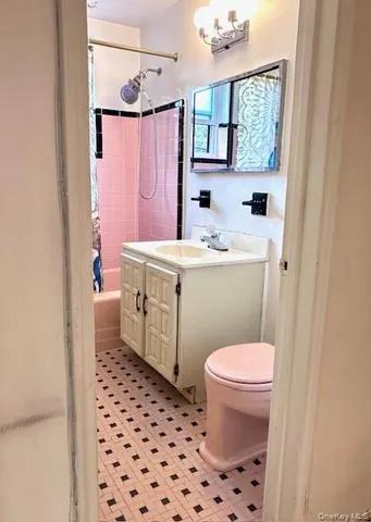a bathroom with a sink toilet a mirror and shower