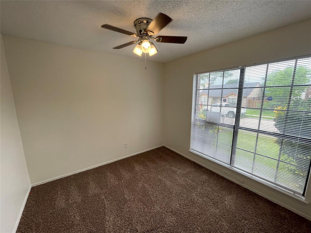 9415 Rutherglen Drive Dallas, TX 75227 - Photo 11 of 18 a view of an empty room with a window