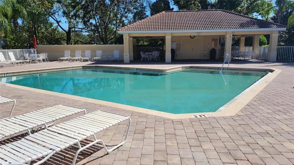 a view of a swimming pool with a lounge chairs