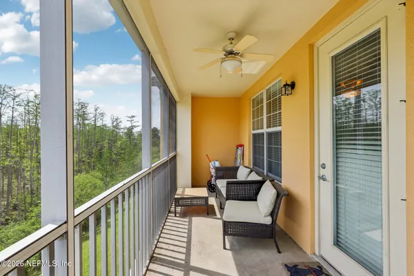 a view of a balcony with furniture