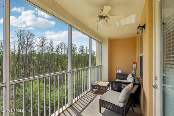 a view of balcony with furniture