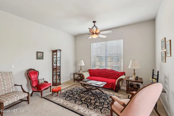 a bedroom with furniture and a window