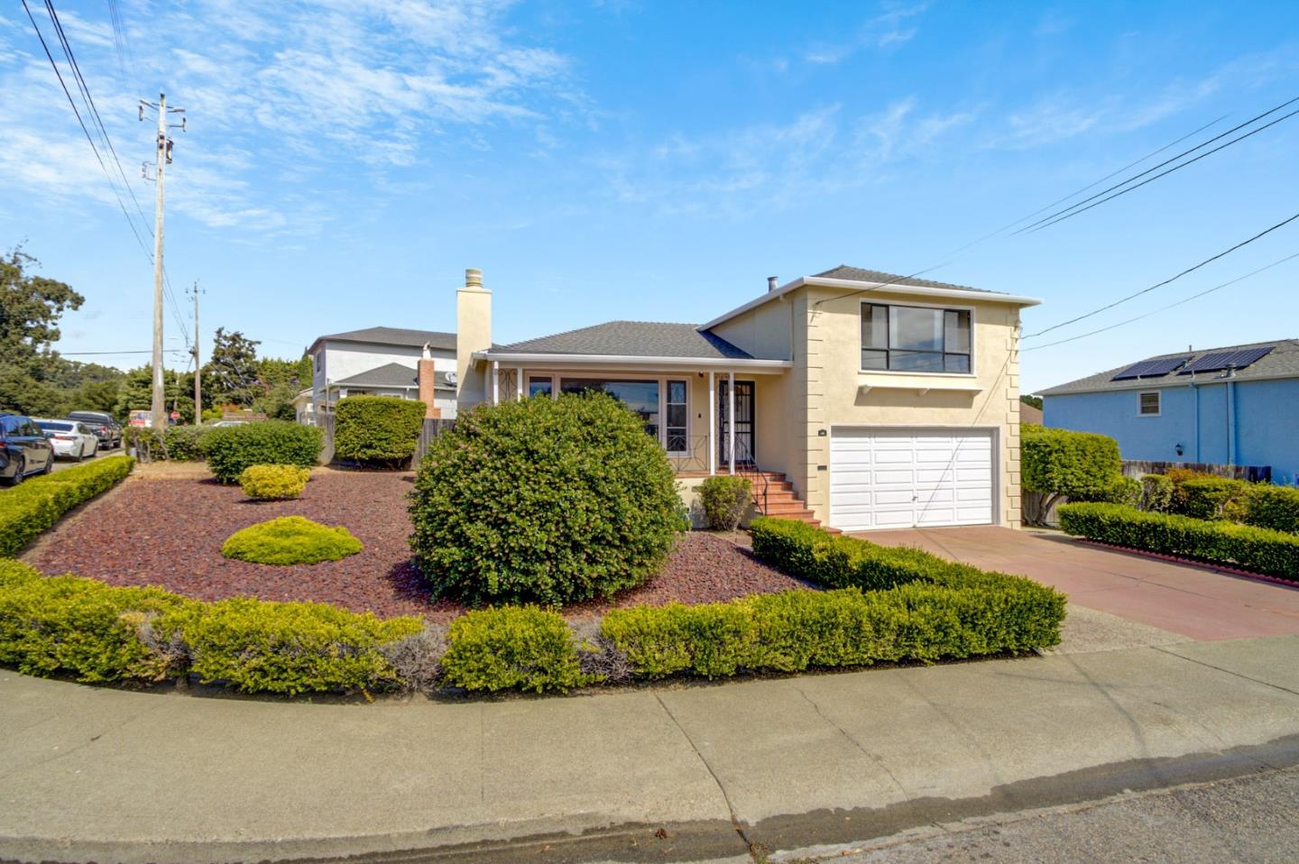 48 Michael Lane Millbrae, CA 94030 - Photo 1 of 1 a front view of a house with a yard and garage