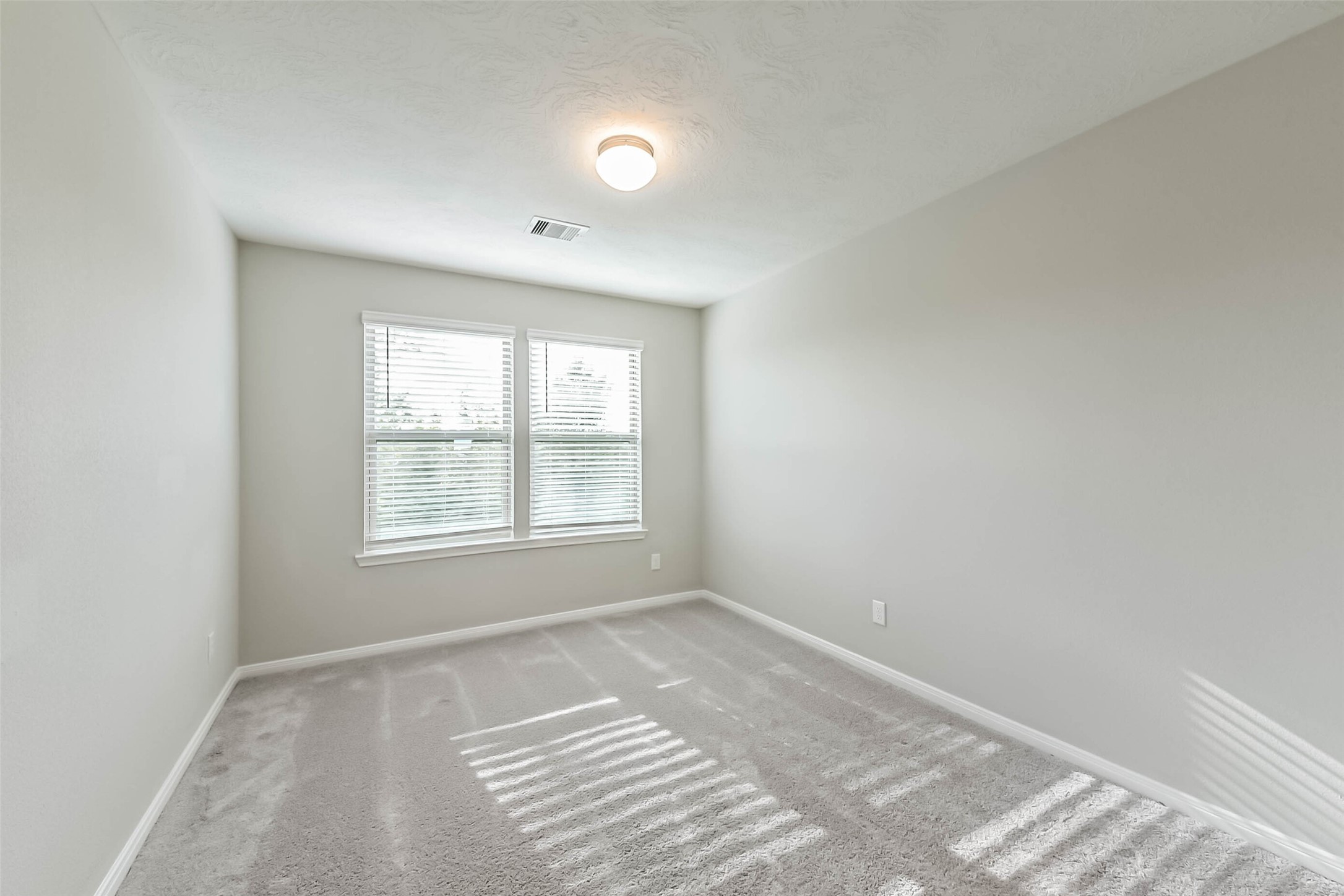 11626 Moonstruck Lane Houston, TX 77048 - Photo 17 of 35 a view of an empty room with a window