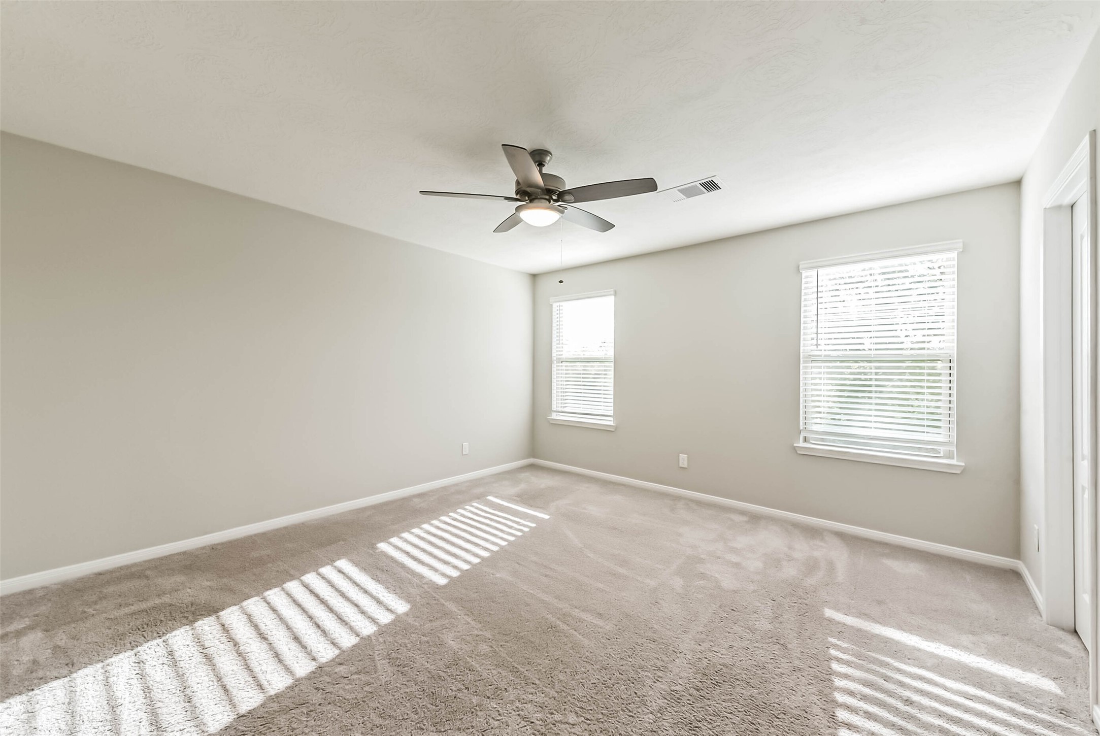 11626 Moonstruck Lane Houston, TX 77048 - Photo 19 of 35 a view of an empty room with a window