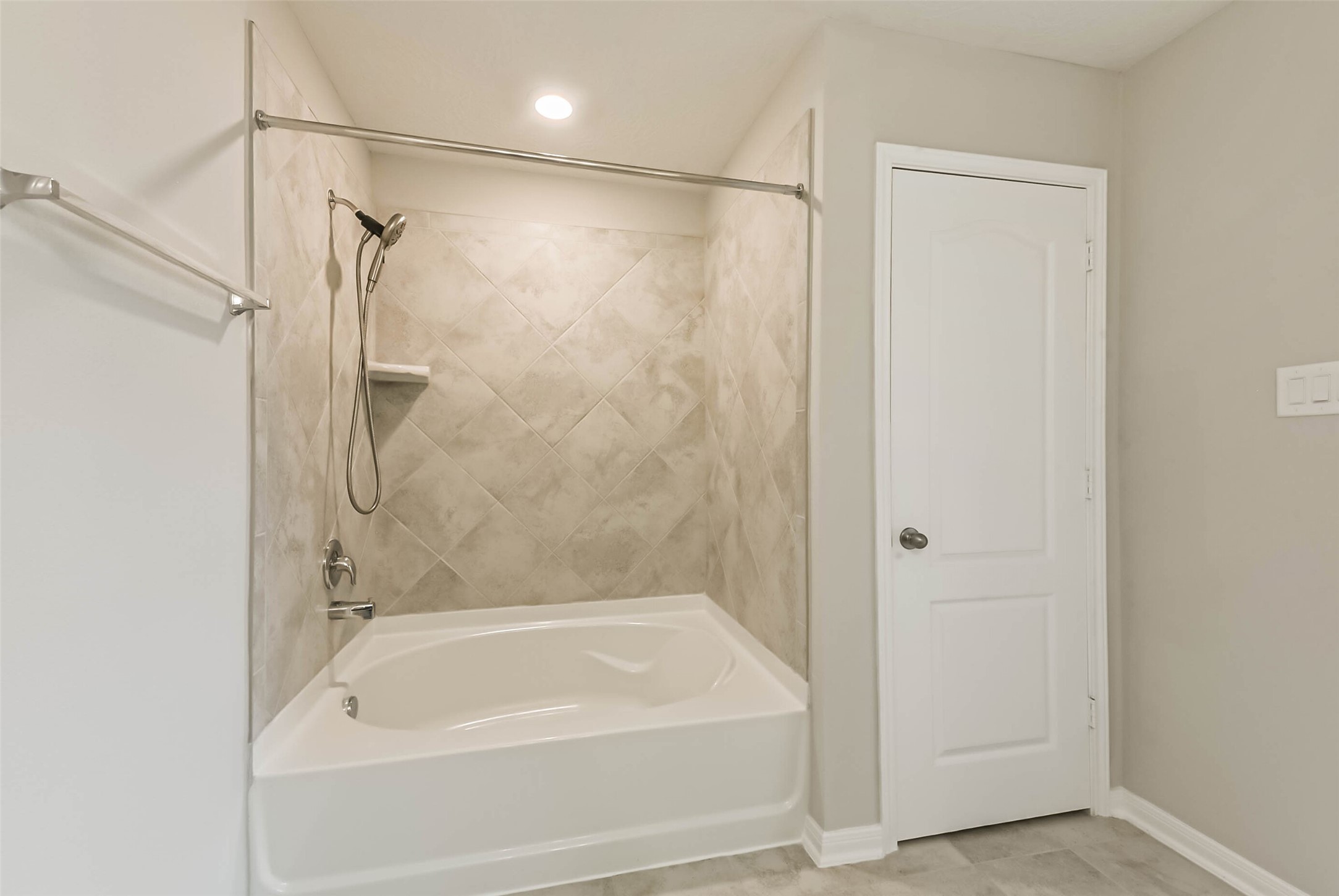 11626 Moonstruck Lane Houston, TX 77048 - Photo 24 of 35 a bathroom with a shower and a bath tub