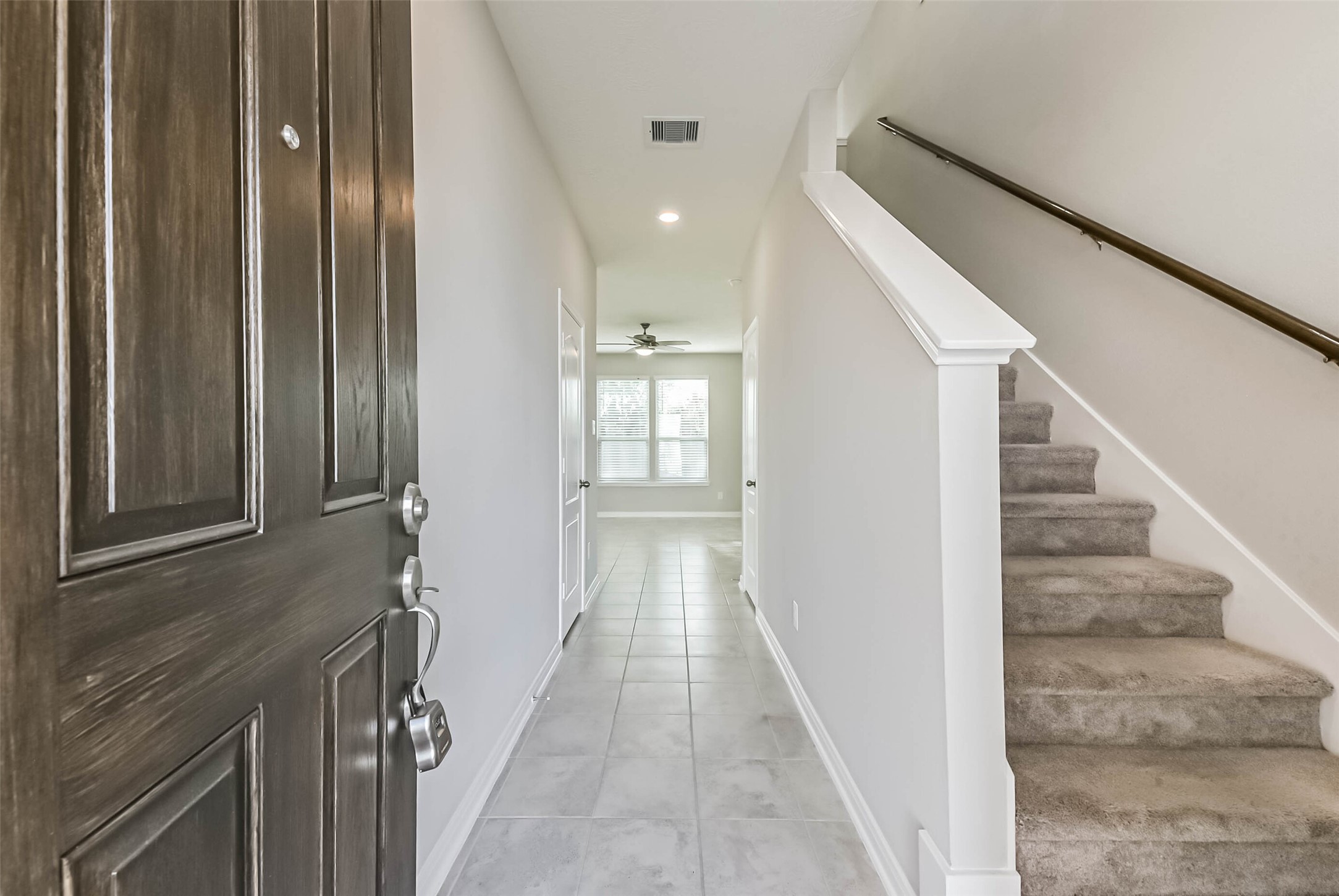 11626 Moonstruck Lane Houston, TX 77048 - Photo 4 of 35 a view of a hallway with wooden floor and staircase