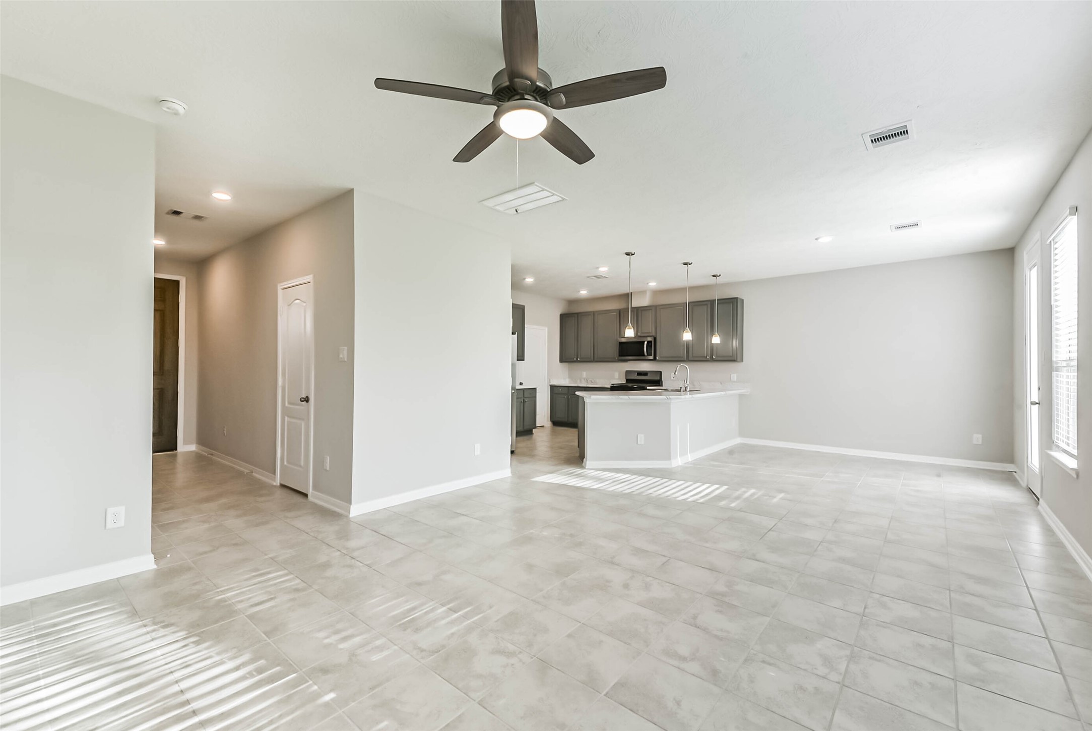 11626 Moonstruck Lane Houston, TX 77048 - Photo 6 of 35 a view of a kitchen with a sink and a refrigerator