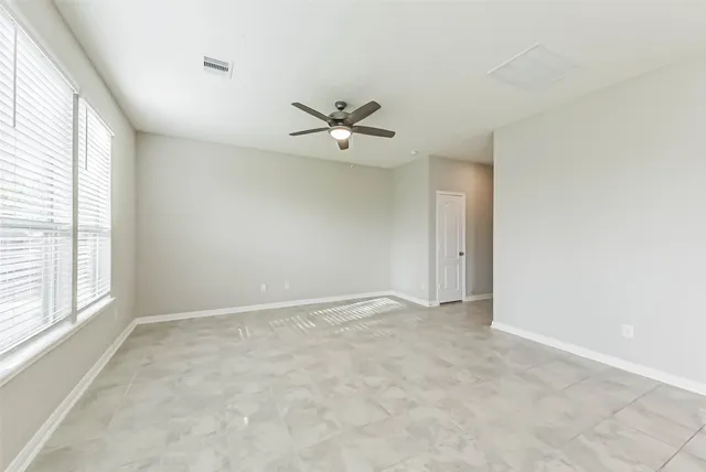 a view of a kitchen with a sink and refrigerator