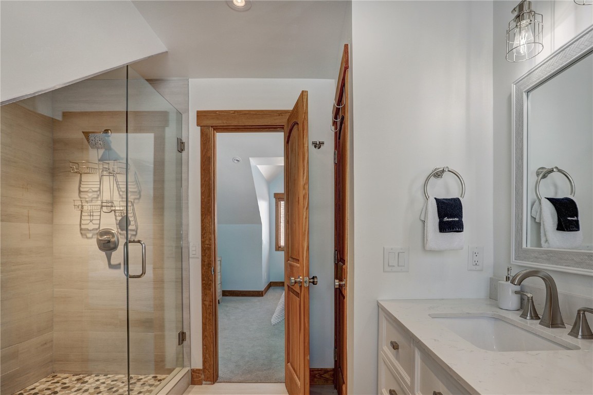 157 Barton Way Breckenridge, CO 80424 - Photo 13 of 40 a bathroom with a sink and mirror