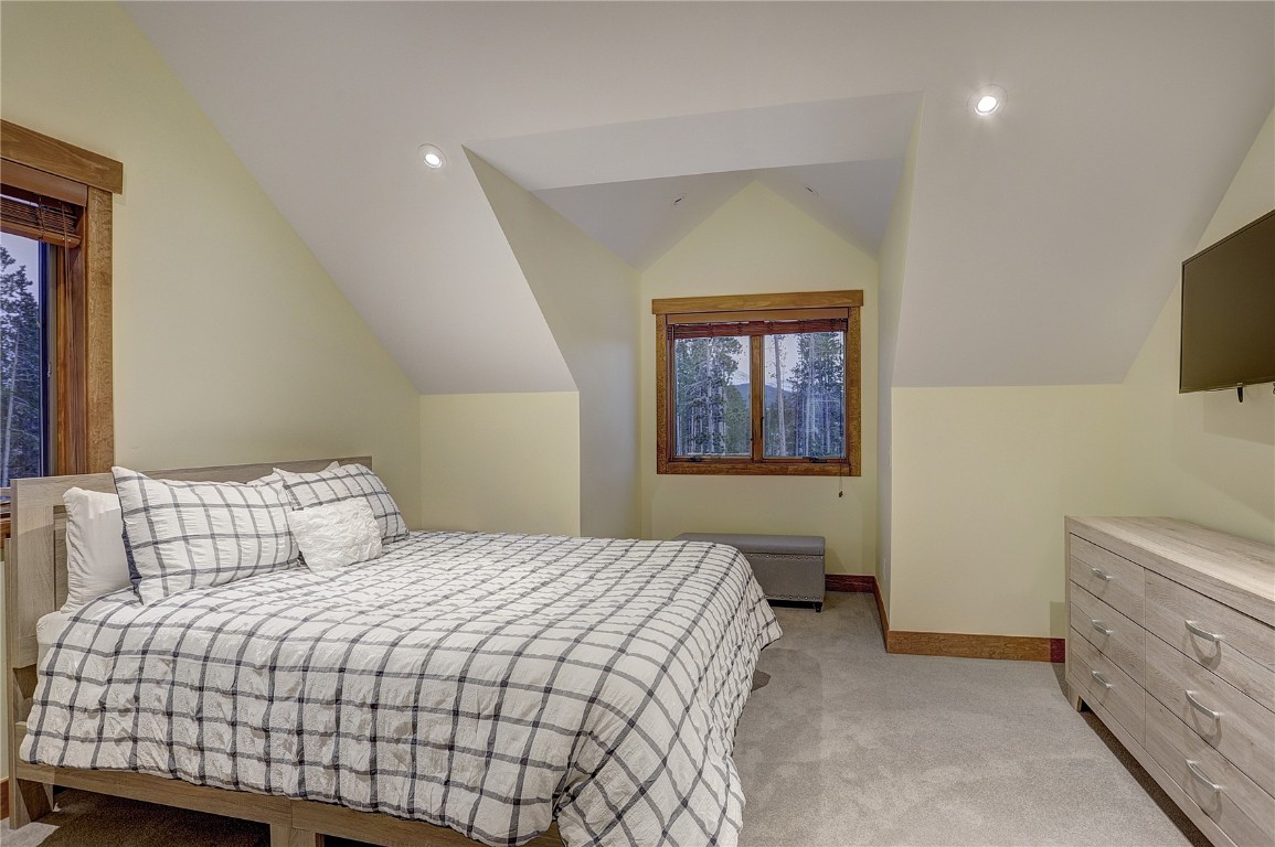 157 Barton Way Breckenridge, CO 80424 - Photo 25 of 40 a bedroom with a bed and a tv