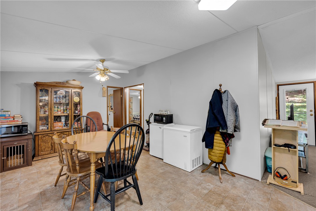 162 Newberry Road Walhalla, SC 29691 - Photo 9 of 50 A well-lit dining area offers a seamless flow into adjacent living spaces, perfect for everyday meals.