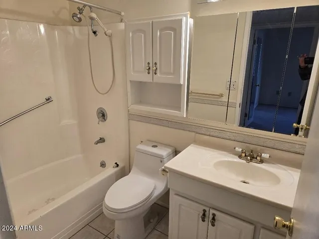 a bathroom with a sink and a window