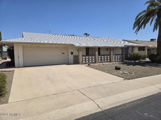 a front view of a building with parking