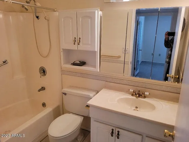 a kitchen with stainless steel appliances a sink stove and cabinets
