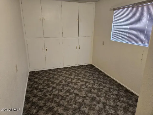 a view of a street with sitting area