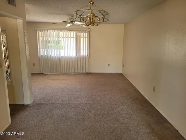 a kitchen with stainless steel appliances a refrigerator sink and microwave
