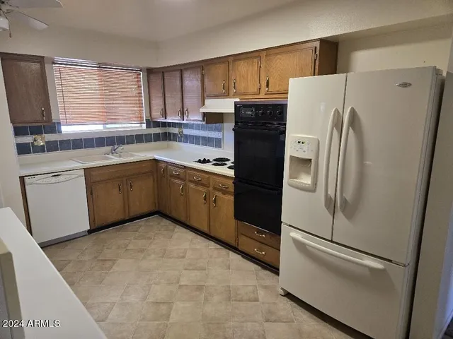 a view of a kitchen from the hallway