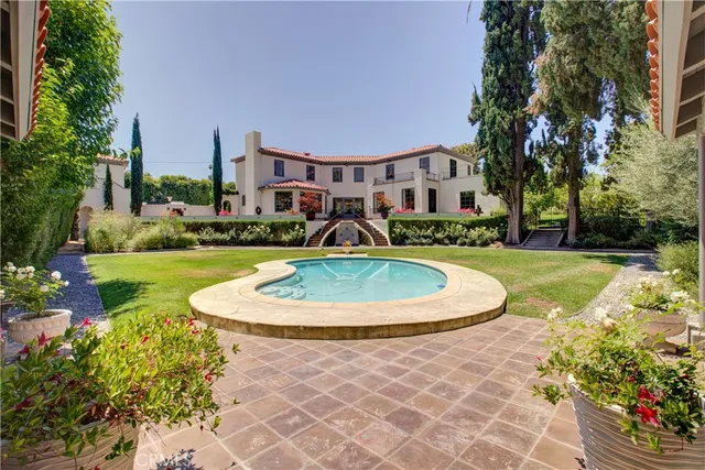 a view of a swimming pool with a garden