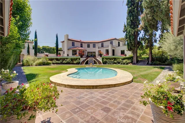 a view of a swimming pool with a garden