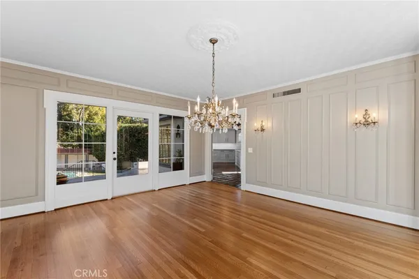 a kitchen with stainless steel appliances granite countertop a sink and a stove