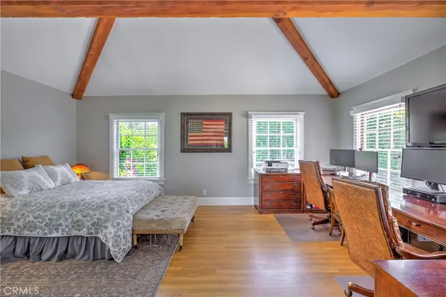 a bedroom with furniture and a window