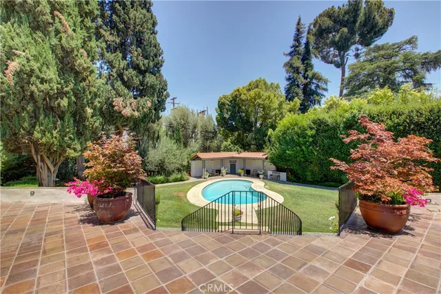an outdoor space with furniture and garden