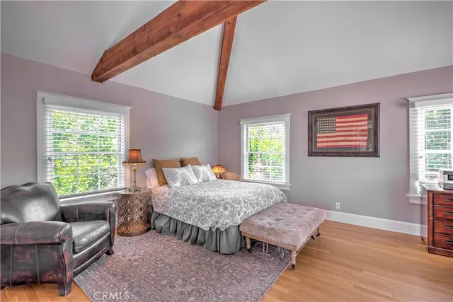 a bedroom with furniture and a window