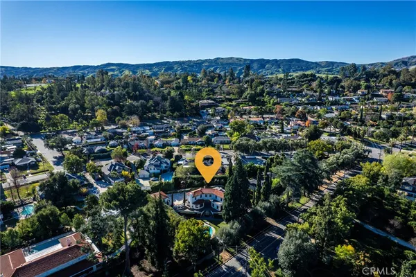 an aerial view of a house with a garden
