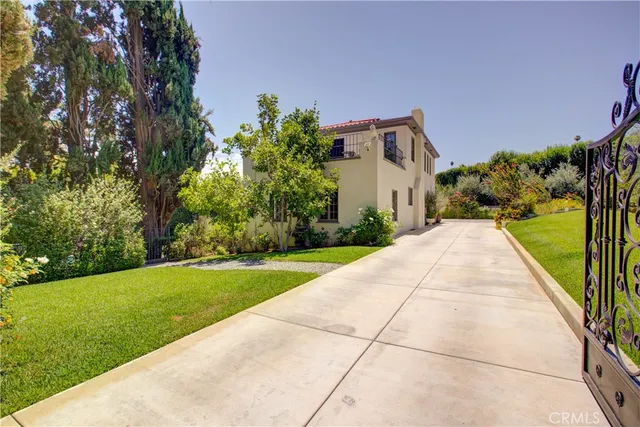 a backyard of a house with lots of green space