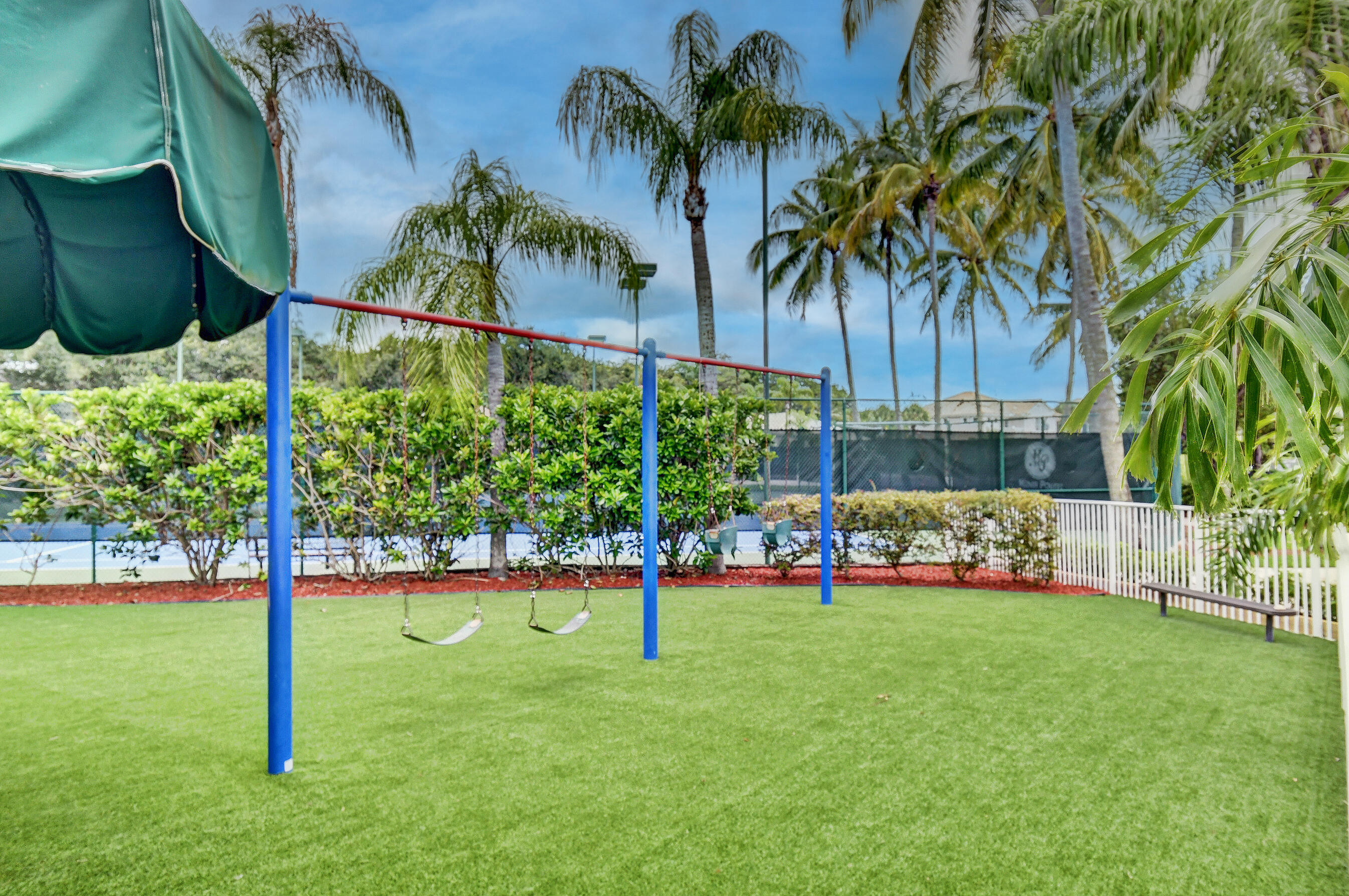 21048 Vía Eden Boca Raton, FL 33433 - Photo 34 of 53 a view of yard with swimming pool and green space