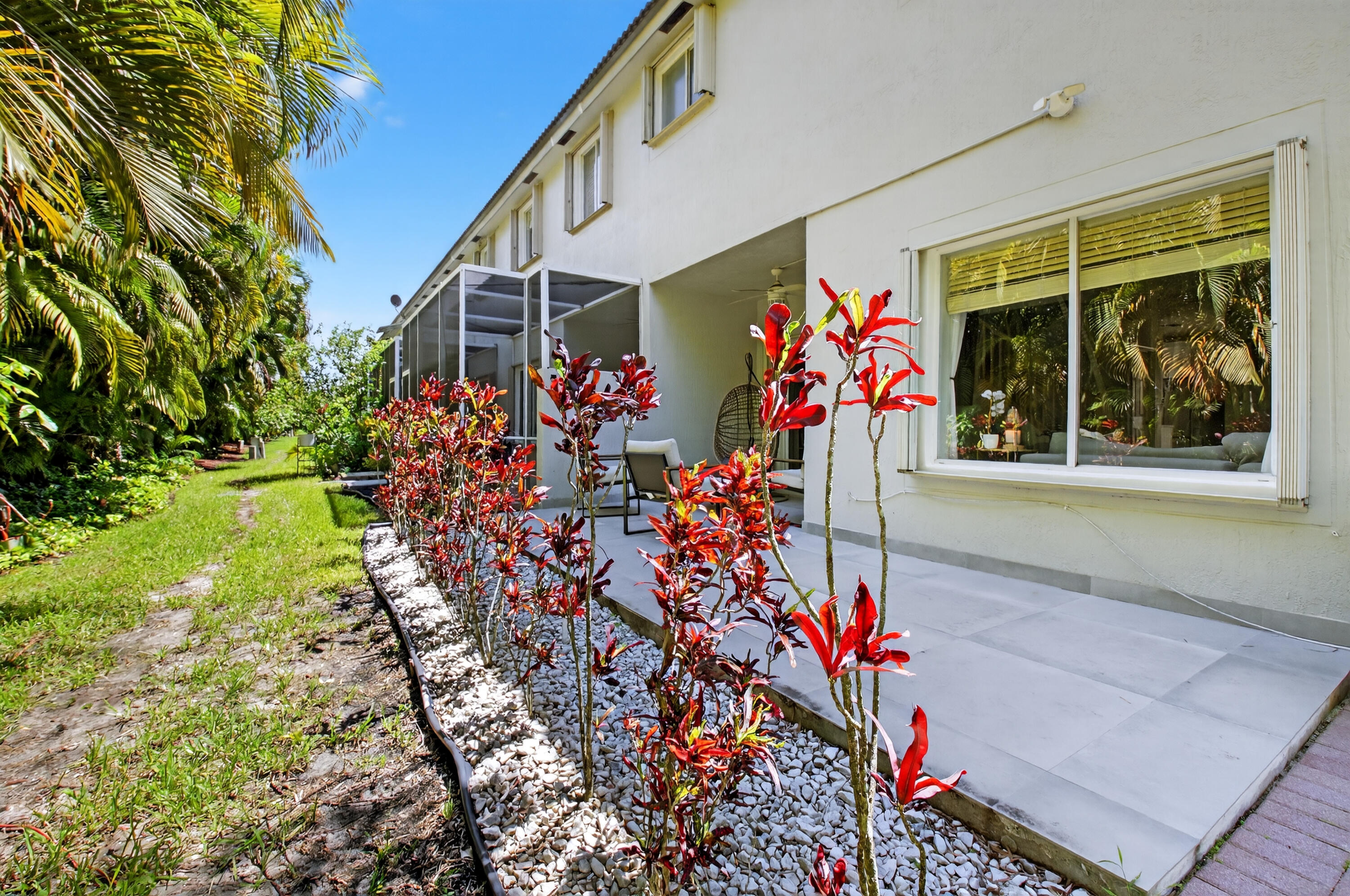 21048 Vía Eden Boca Raton, FL 33433 - Photo 50 of 53 a front view of a house with a yard