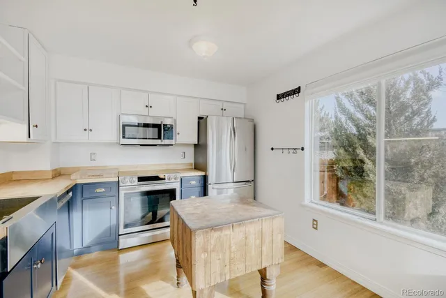 a view of kitchen island with wooden floor