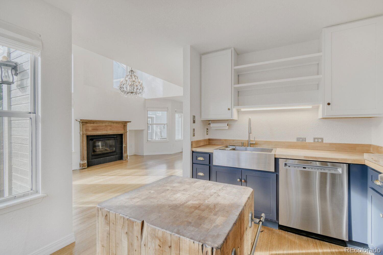 5174 Buckingham Road Boulder, CO 80301 - Photo 13 of 33 a kitchen with a stove a sink and a refrigerator