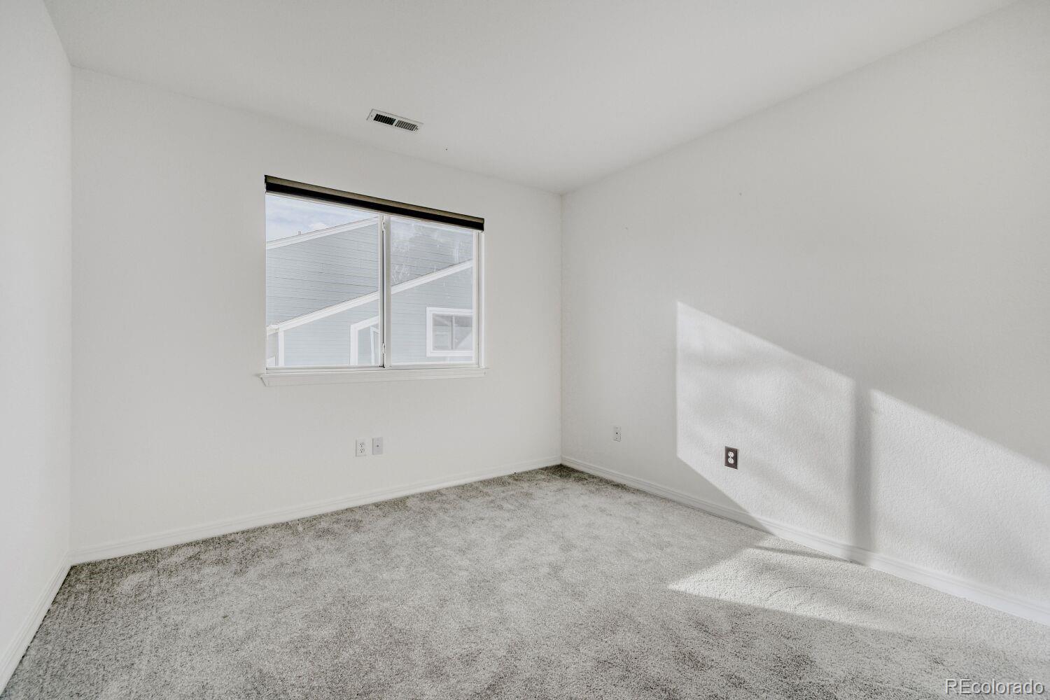 5174 Buckingham Road Boulder, CO 80301 - Photo 25 of 33 a view of an empty room with a window