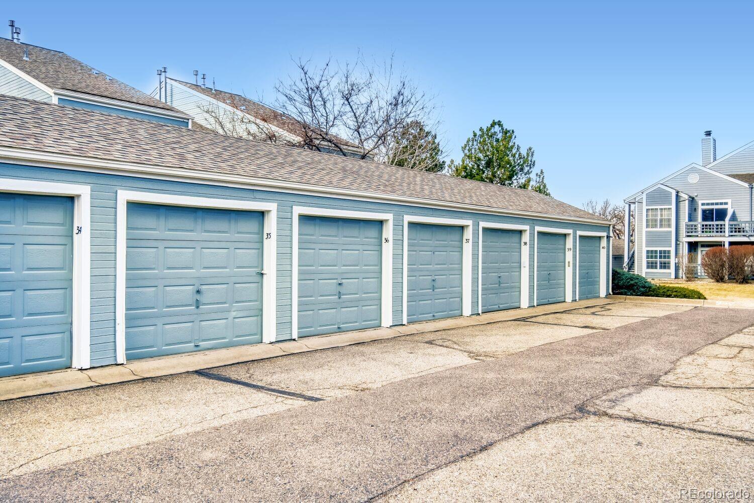 5174 Buckingham Road Boulder, CO 80301 - Photo 29 of 33 a front view of a house with a yard and garage