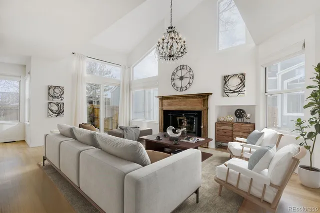 a view of an empty room with a fireplace and a window
