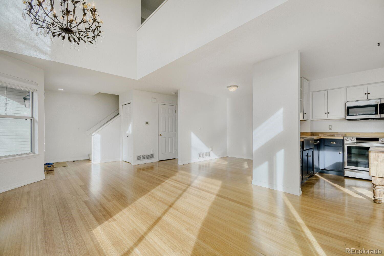 5174 Buckingham Road Boulder, CO 80301 - Photo 5 of 33 a view of empty room with wooden floor