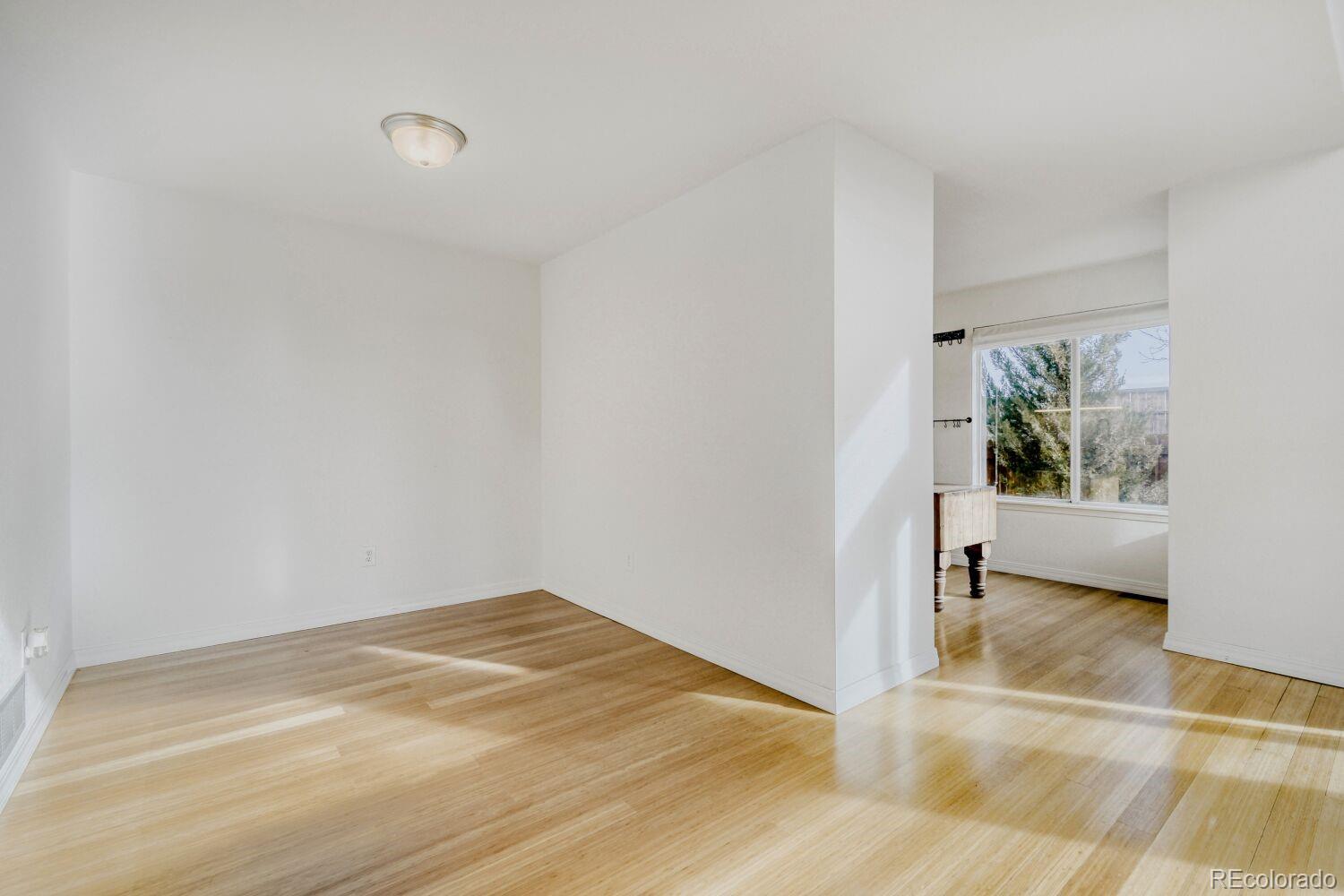5174 Buckingham Road Boulder, CO 80301 - Photo 6 of 33 a view of a room with wooden floor and a window