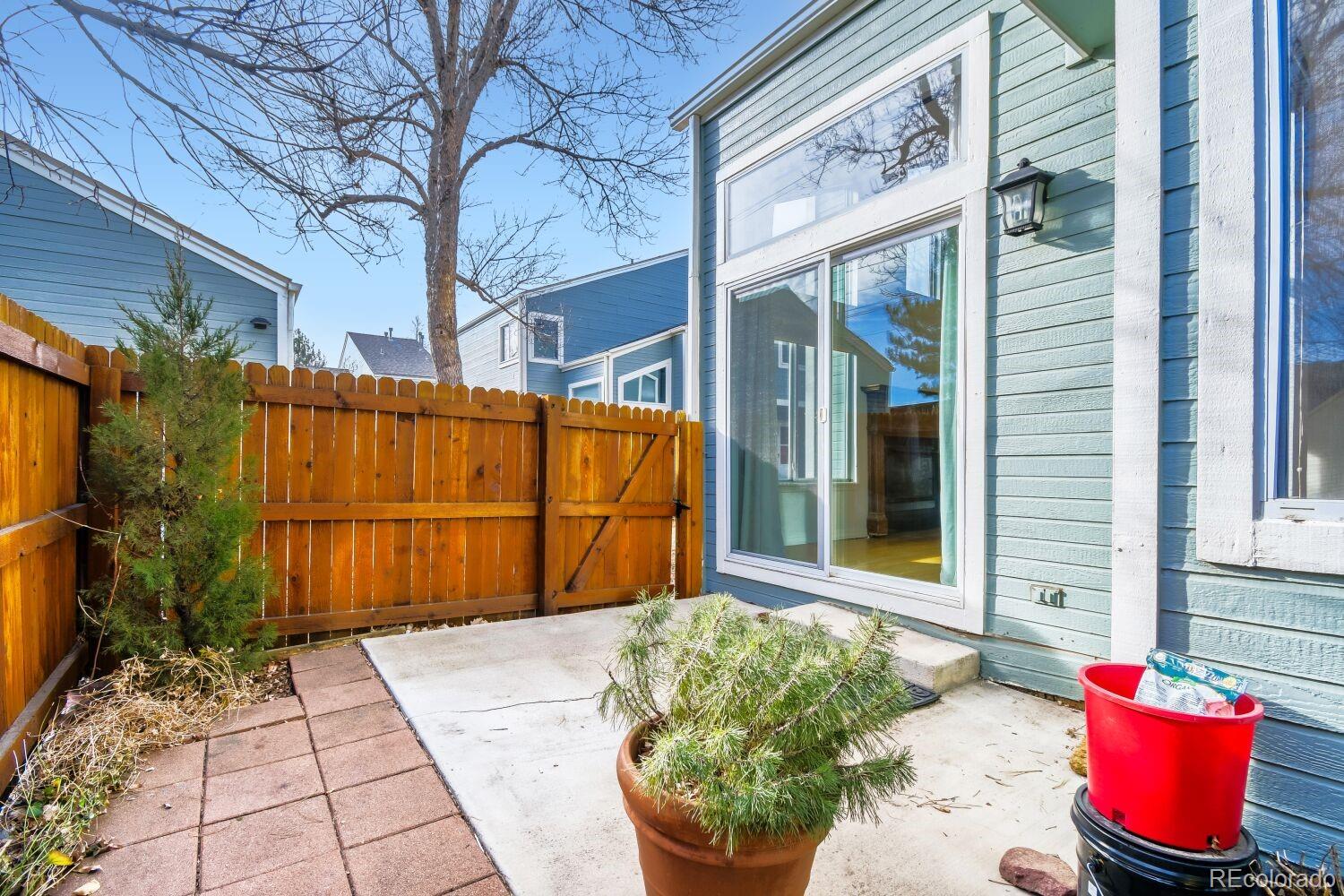 5174 Buckingham Road Boulder, CO 80301 - Photo 9 of 33 a view of a brick house with a potted plant