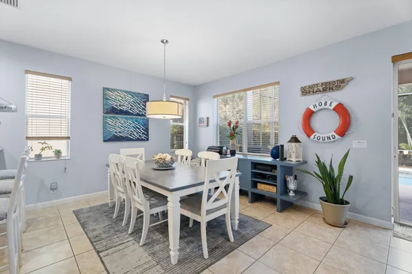 a view of a dining room with furniture window and outside view