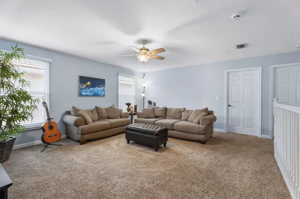 a living room with furniture and a window