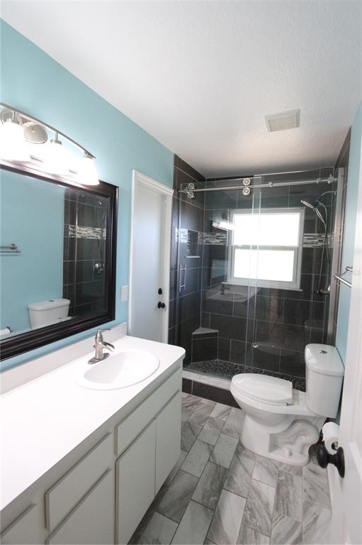 1414 Norwick Drive Lutz, FL 33559 - Photo 29 of 43 a bathroom with a sink toilet and shower