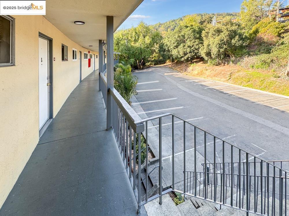 195 Los Robles Road Novato, CA 94949 - Photo 19 of 26 a view of a porch with wooden floor and fence
