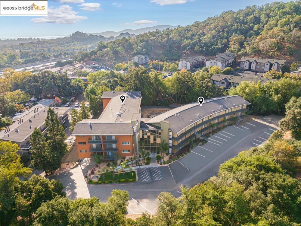 195 Los Robles Road Novato, CA 94949 - Photo 4 of 26 an aerial view of a house with a garden and lake view