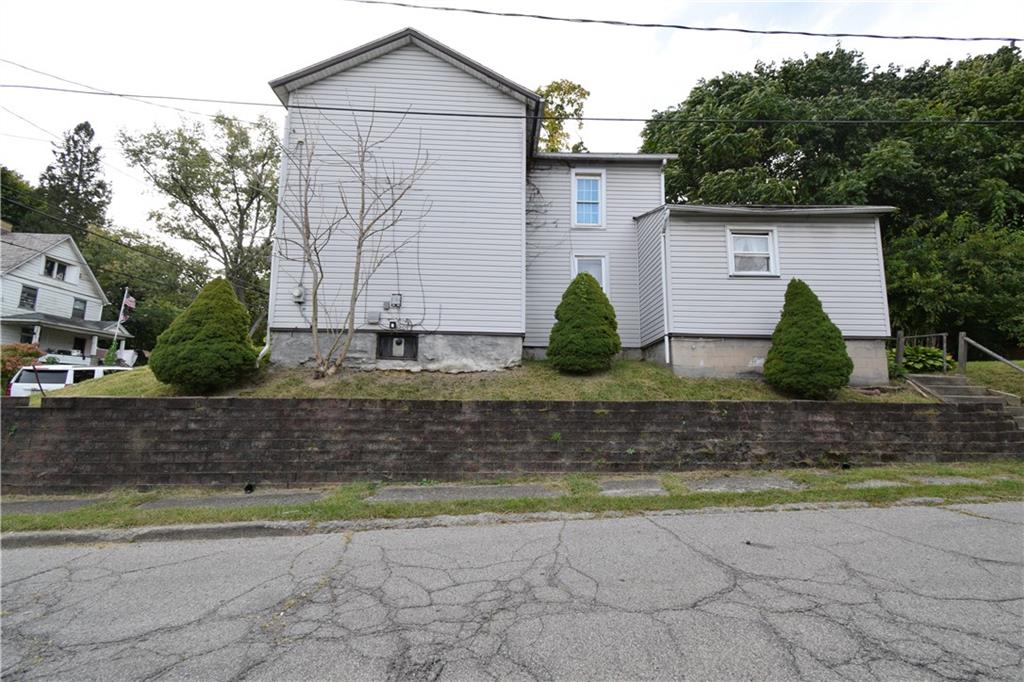 376 Ellsworth Street Sharon, PA 16146 - Photo 2 of 10 a view of a house with a yard and plants