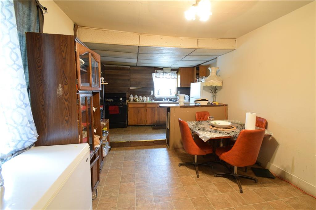 376 Ellsworth Street Sharon, PA 16146 - Photo 5 of 10 a room with stainless steel appliances kitchen island granite countertop furniture and a refrigerator