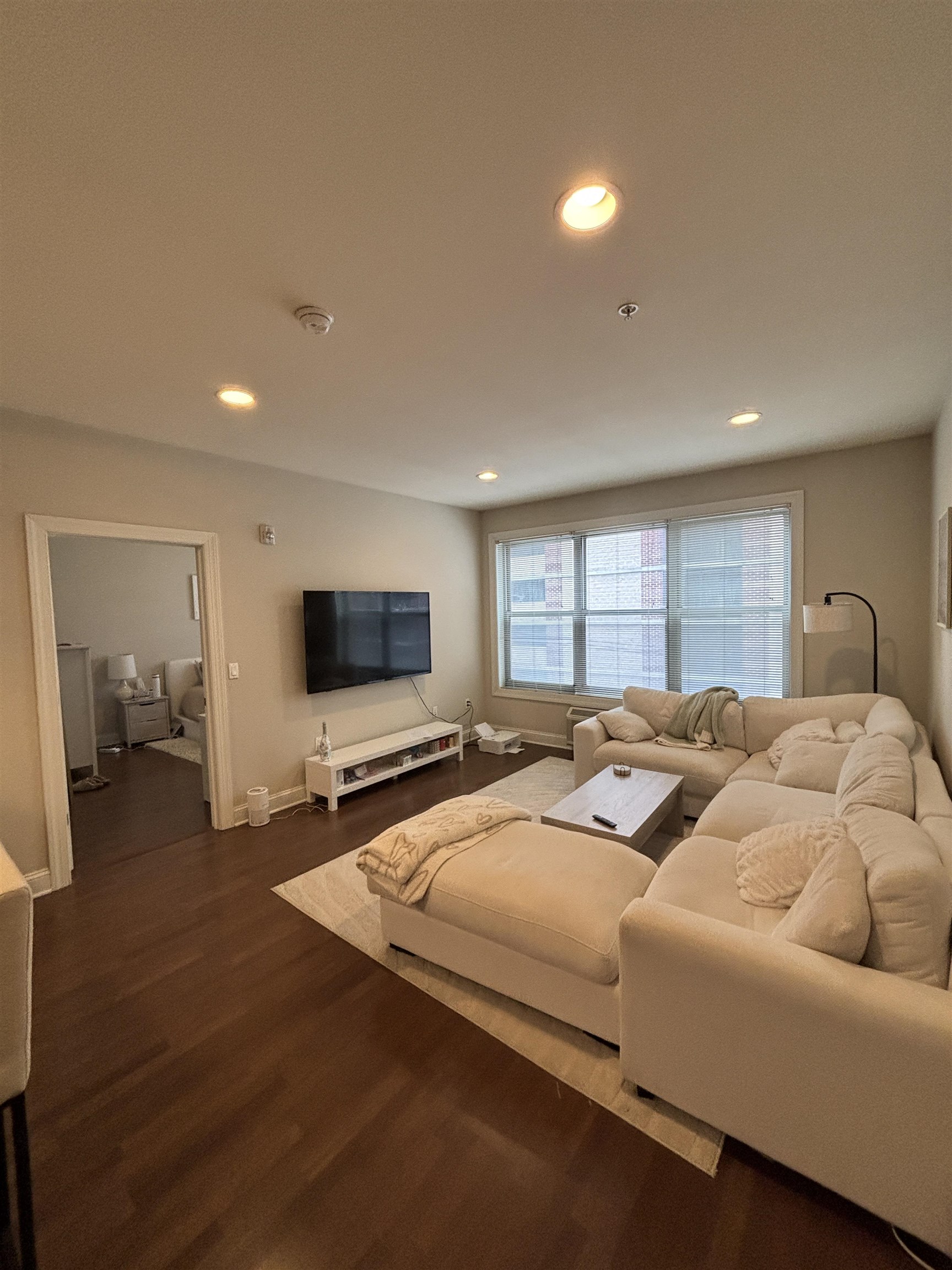 100 Marshall Street, Unit 316 Hoboken, NJ 07030 - Photo 3 of 9 a living room with furniture and a flat screen tv